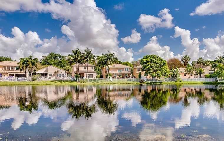 view of homes in florida and the lake reflection